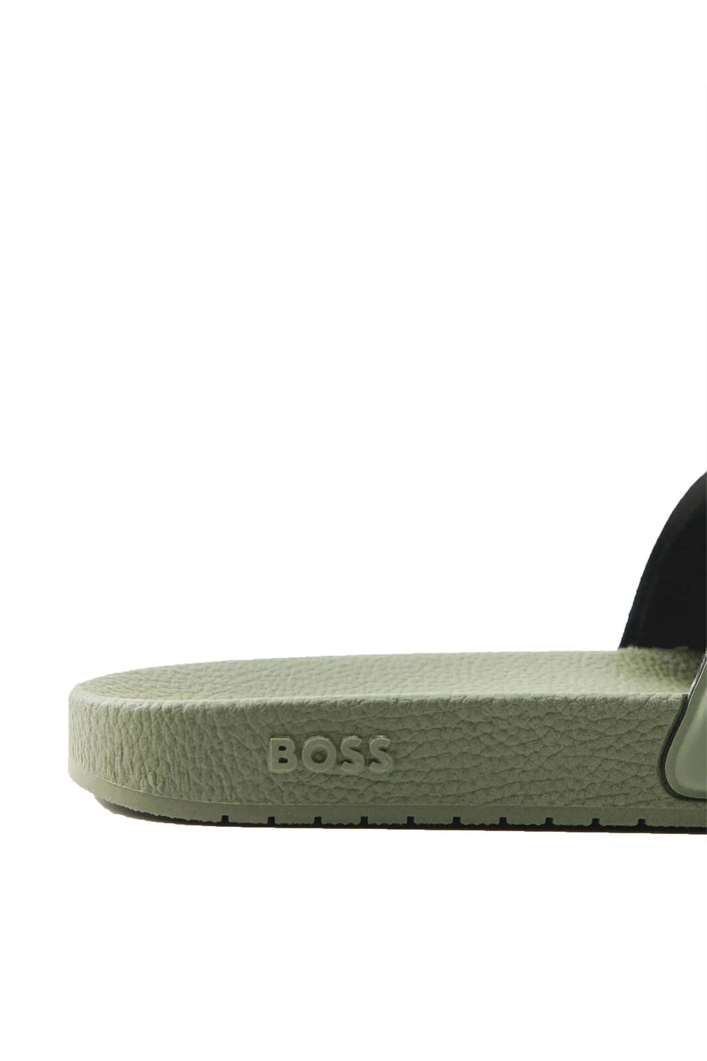 Close up of a Green sandal with 'BOSS' branding on a white background