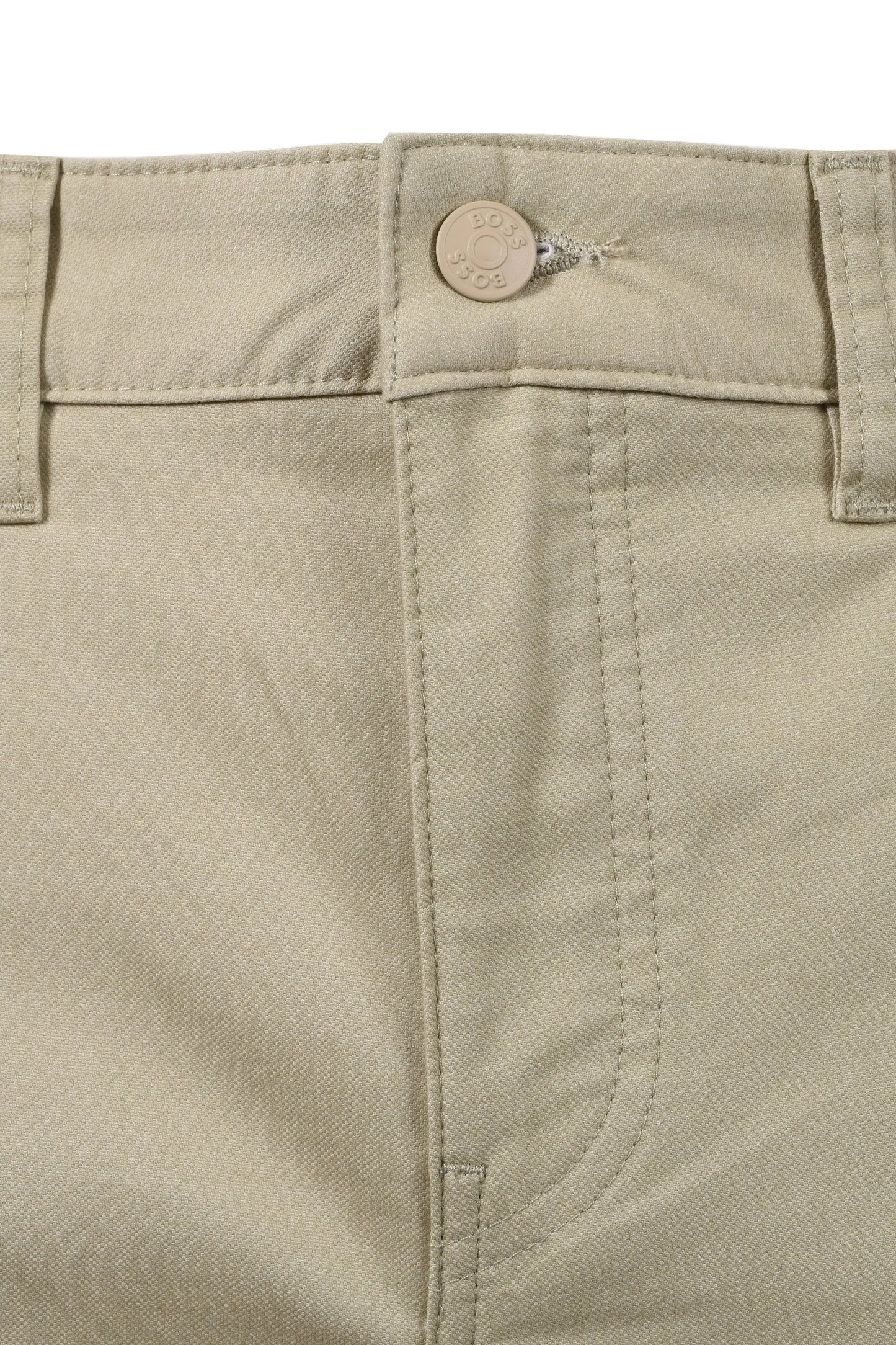 Close-up of beige BOSS trousers with a button and stitching detail