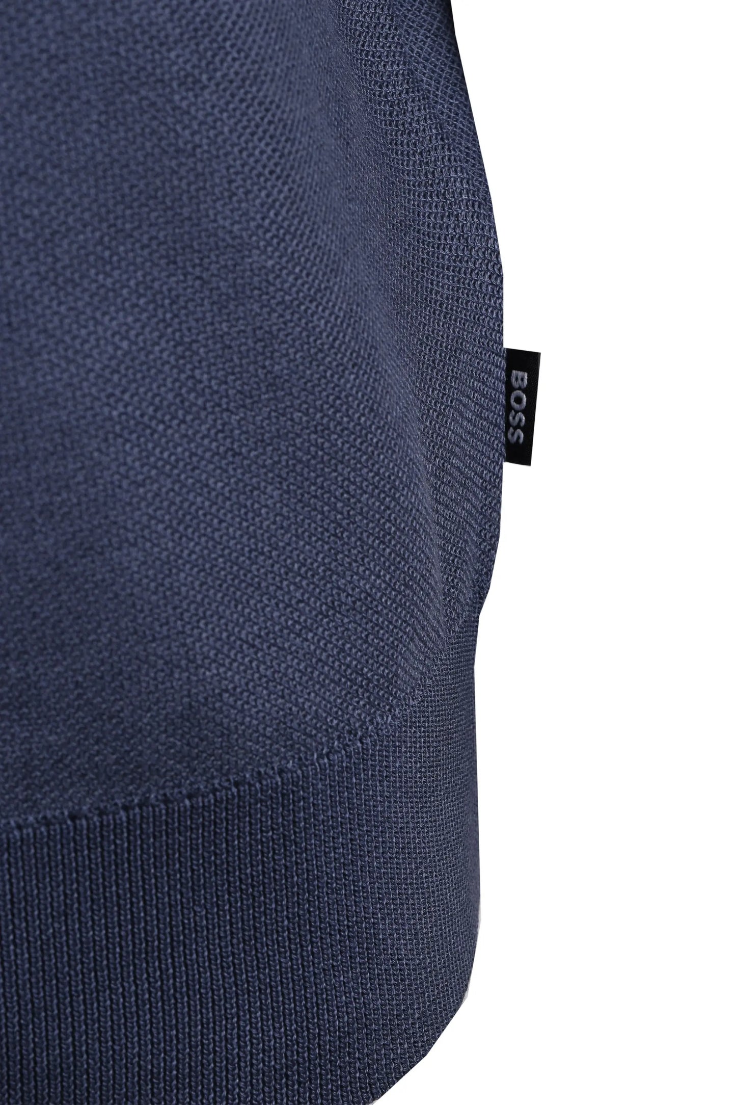 blue KNITTED TOP CLOSE UP OF a BOSS logo on a white background