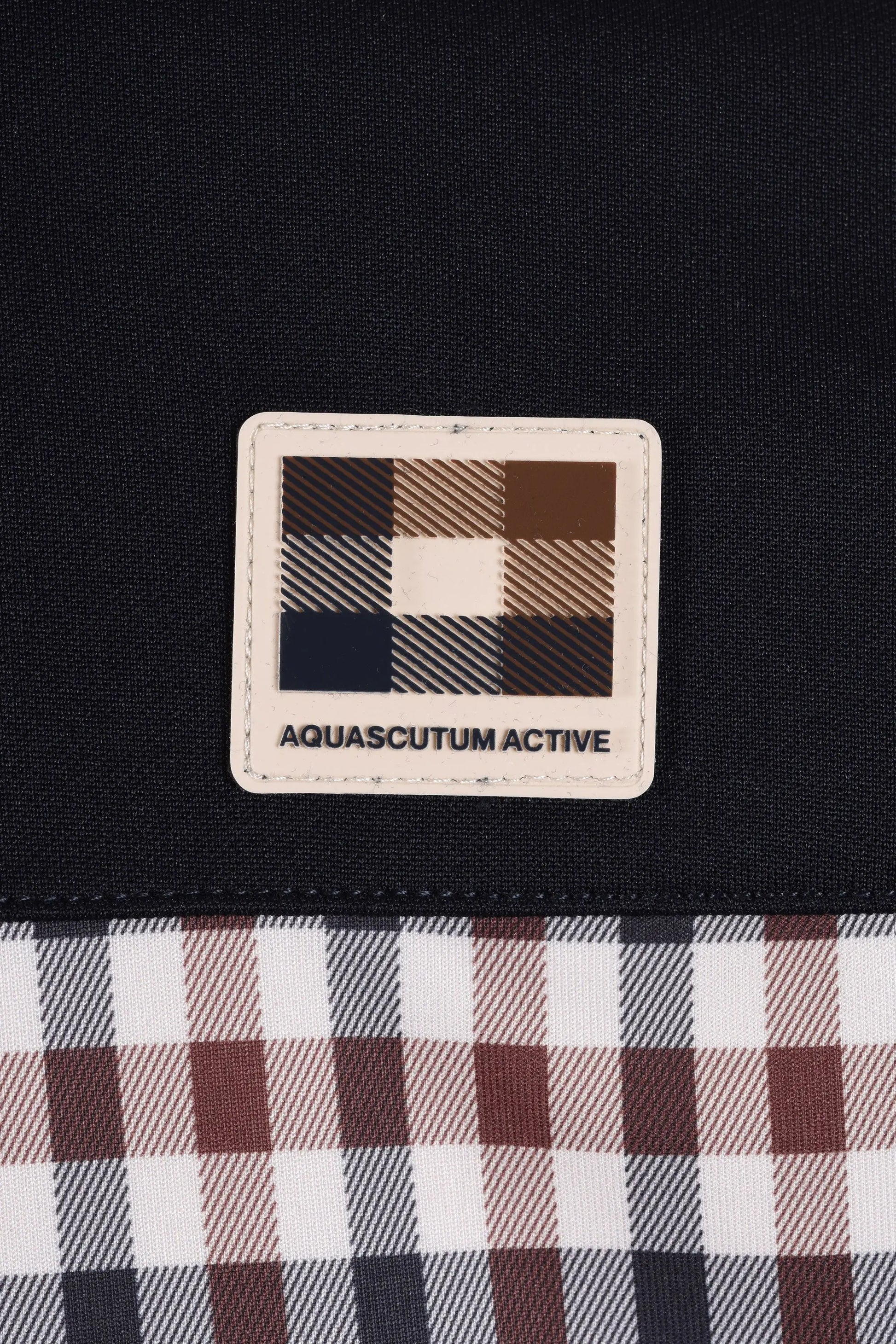 Aquascutum active logo on club check t-shirt close up of logo 