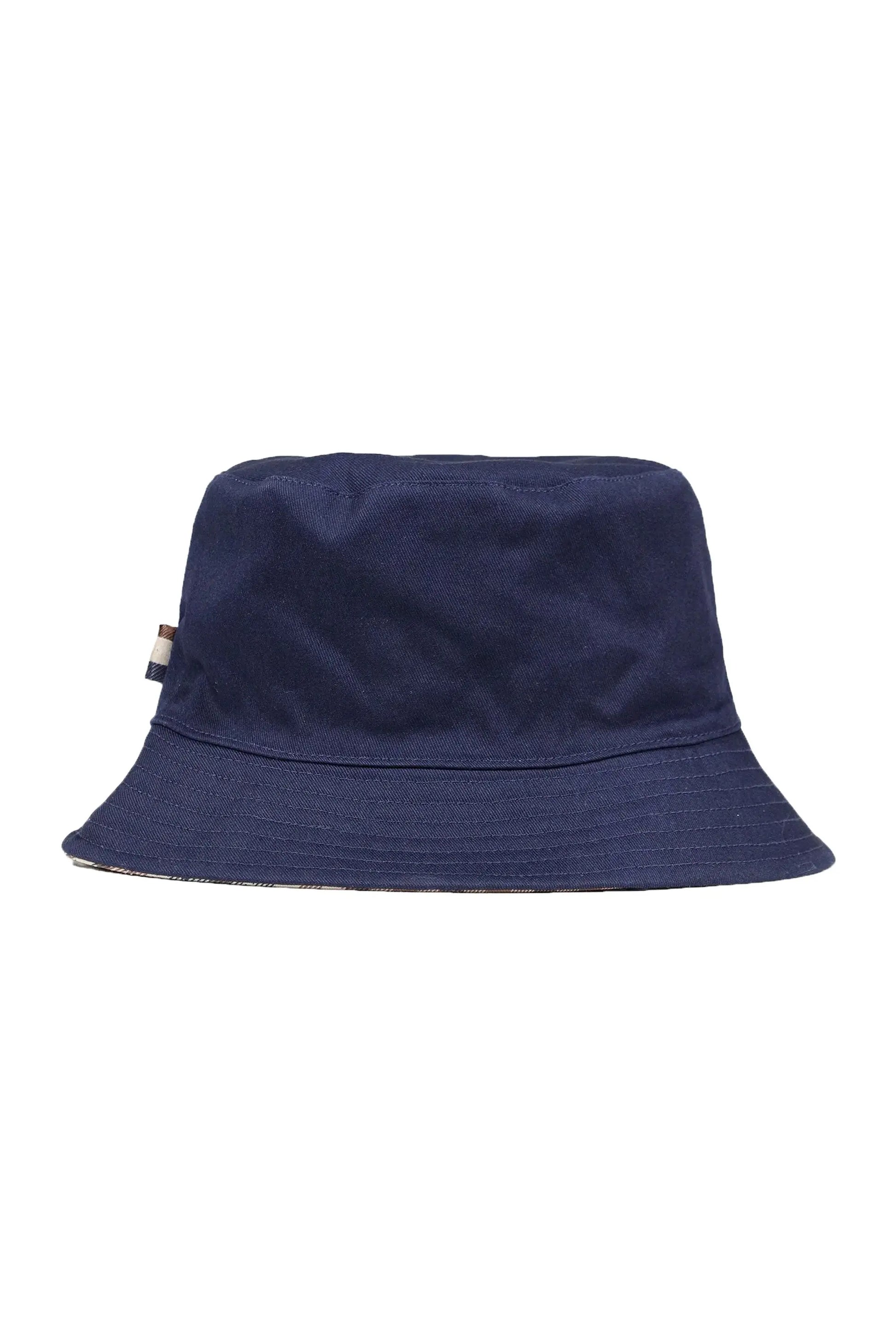 A picture of a Aquascutum bucket hat in the colour dark navy with a Aquascutum brand tag on the seam of the hat.