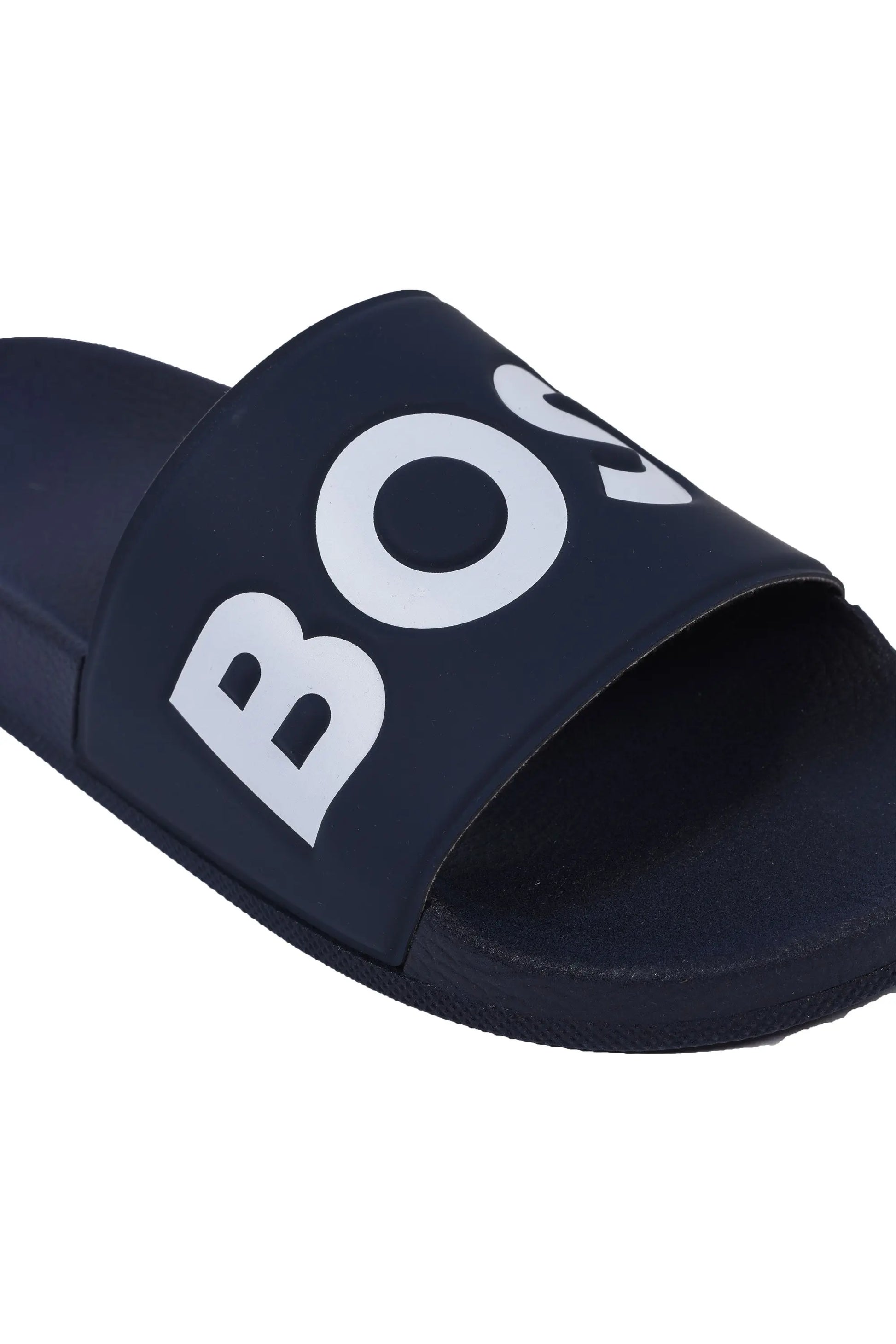 Close up of the branded toe of a Boss Aryeh slider, pictured upon a white background.