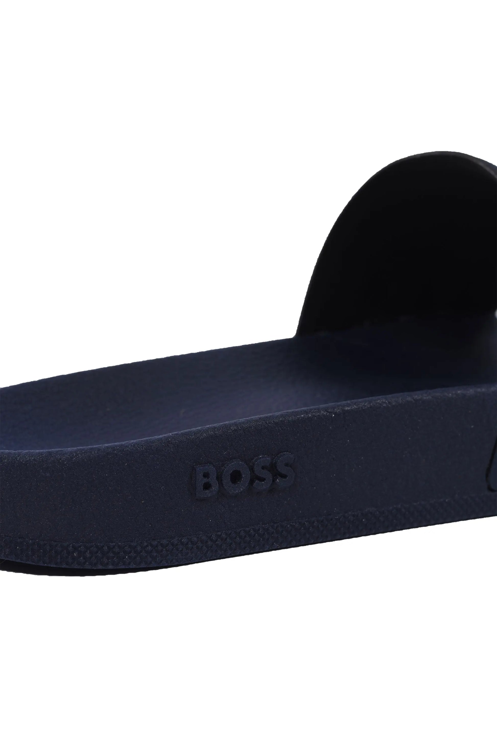 Close up of the Boss branding on the sole of a Boss Aryeh slider in the colour dark blue.
