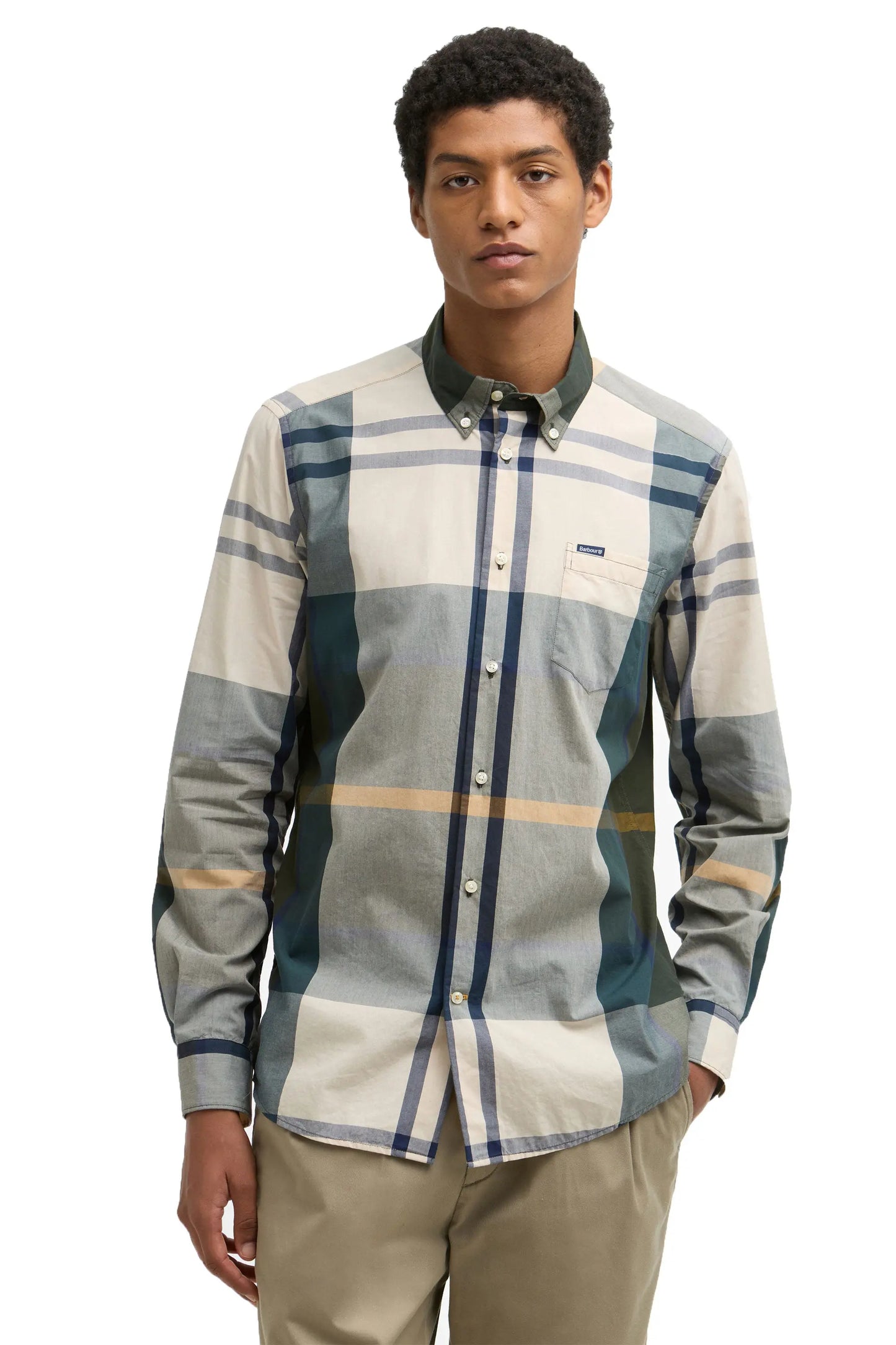 The front view of a man wearing a Harris shirt in ancient tartan.