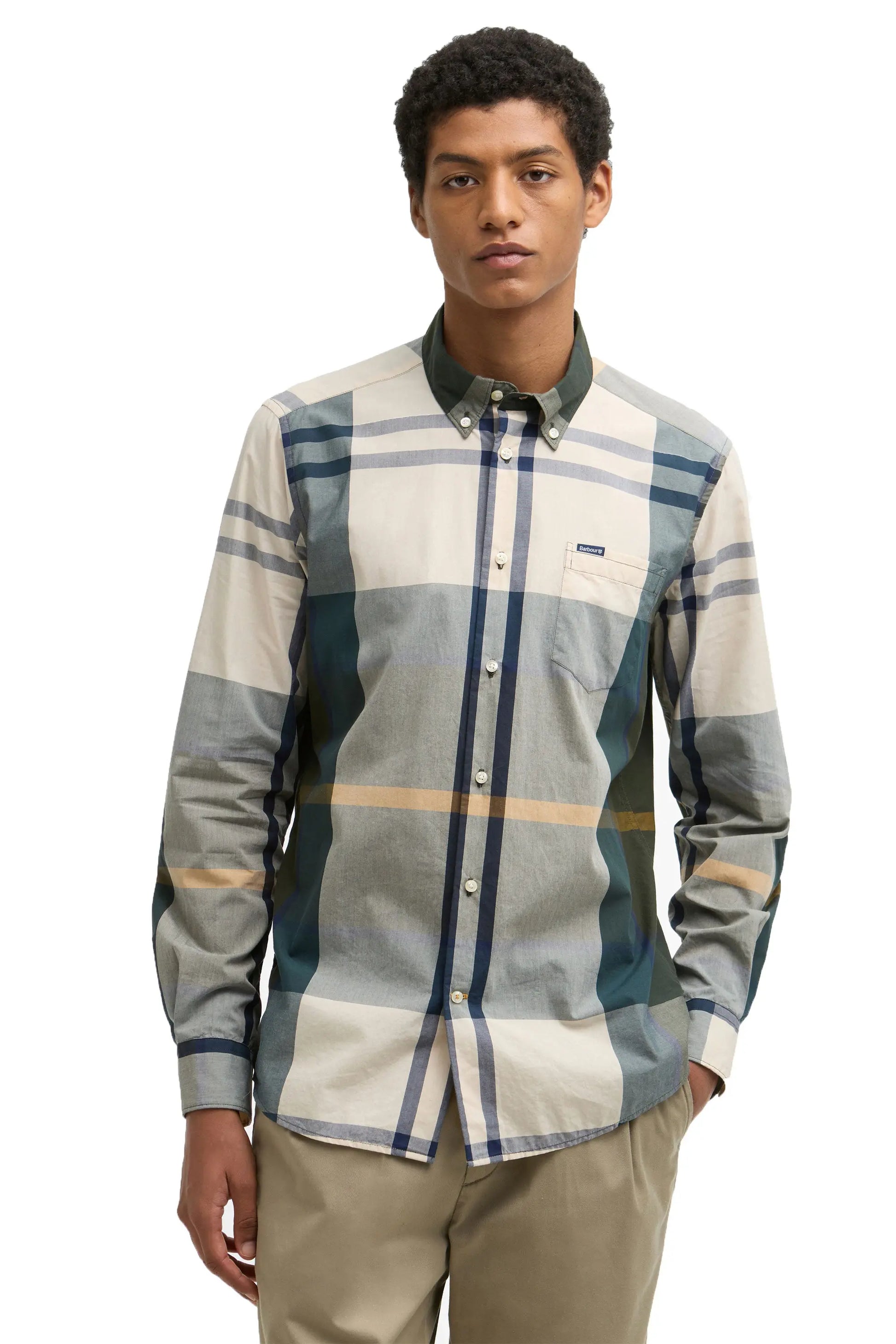 The front view of a man wearing a Harris shirt in ancient tartan.