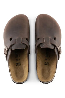 Pair of BIRKENSTOCK brown clogs on a white background