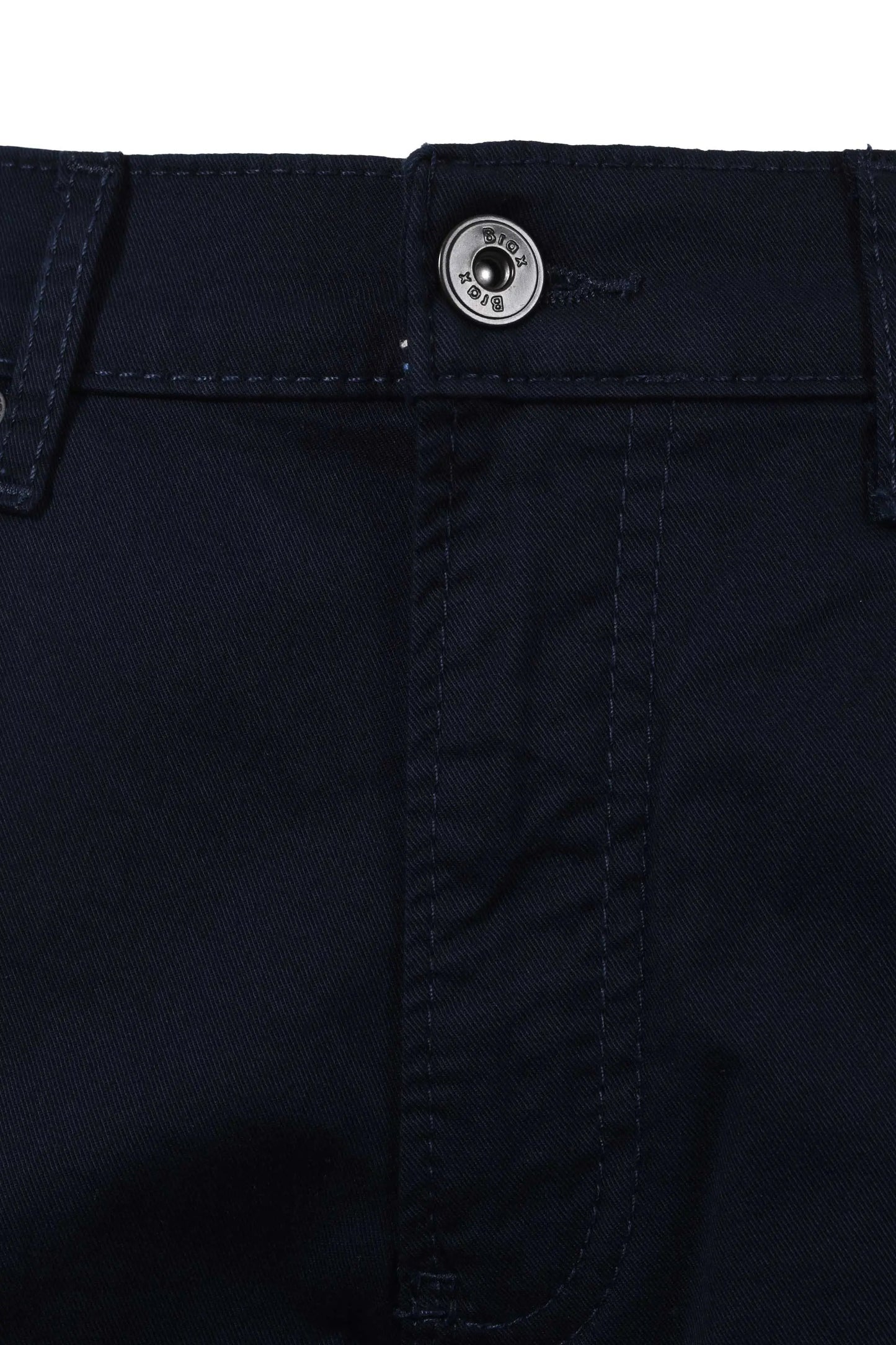 Close up picture of the button and fly closure on a pair of Brax Chuck cotton jeans in navy colour.