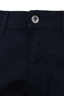 Close up picture of the button and fly closure on a pair of Brax Chuck cotton jeans in navy colour.