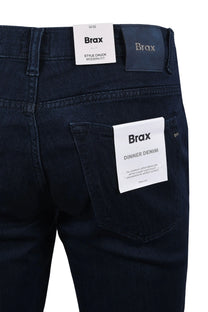 Brax dinner denim Chuck jeans in a dark denim colour, the picture shows the back pocket as well as the metal branded leather patch on the back of the jeans.