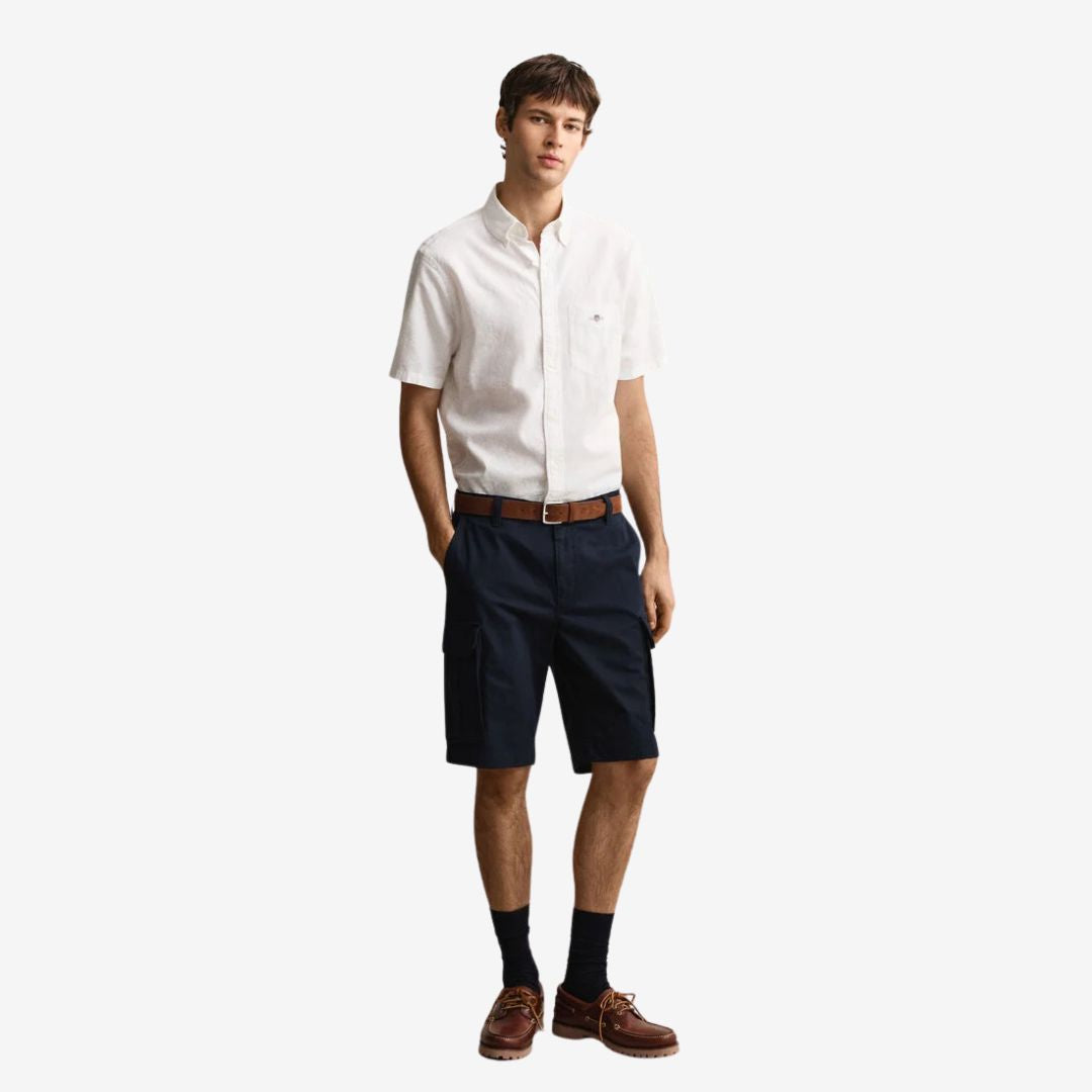 Man wearing a white Barbour full button down shirt.