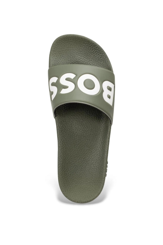 Green slide sandal with 'BOSS' branding in white on a white background