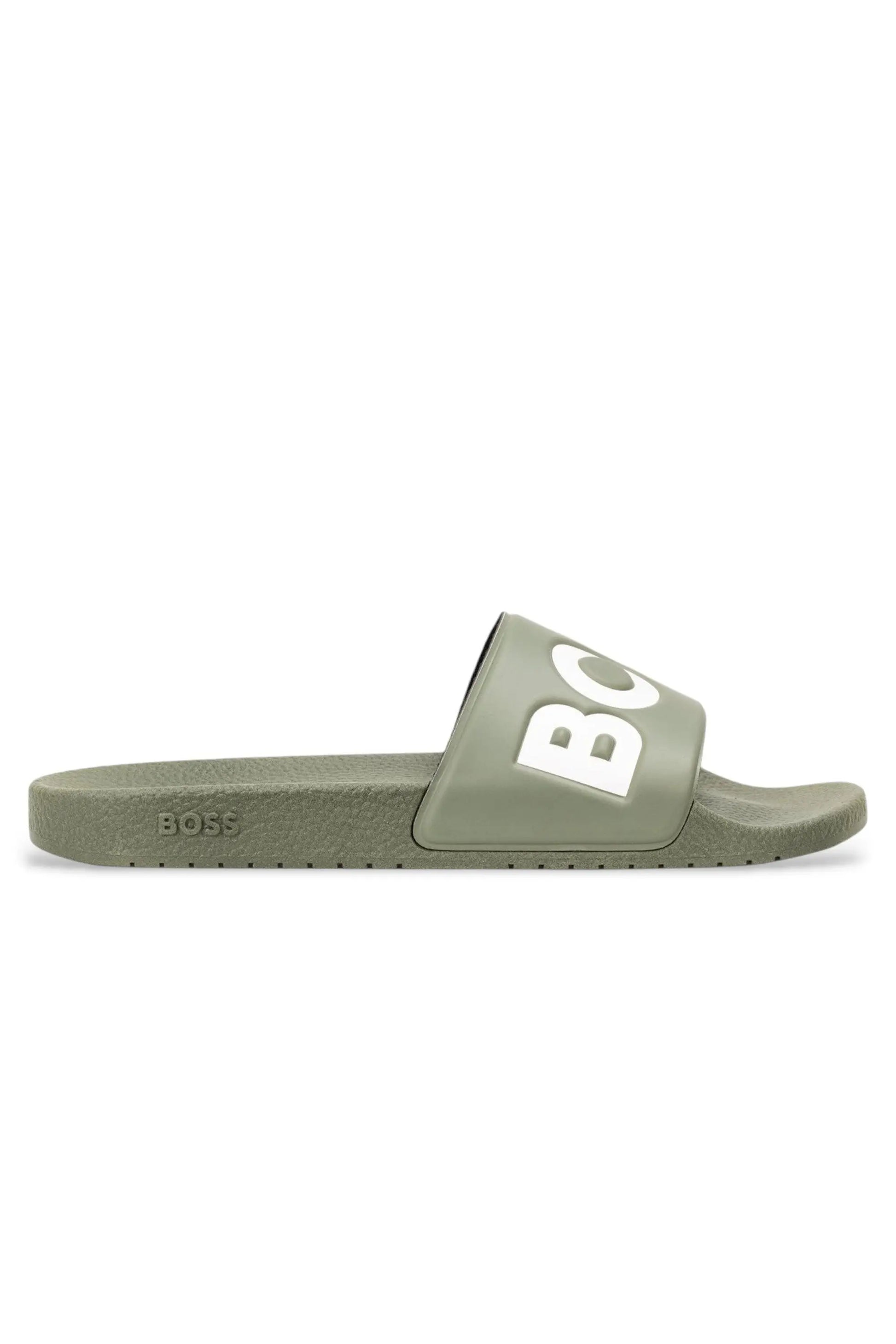 Green slide sandal with 'BOSS' branding on a white background