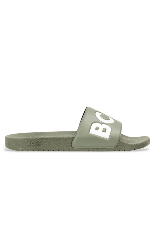 Green slide sandal with 'BOSS' branding on a white background