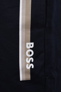 A close up of the branding down the leg of a pair of Boss Black Boss authentic shorts in the colour dark blue.