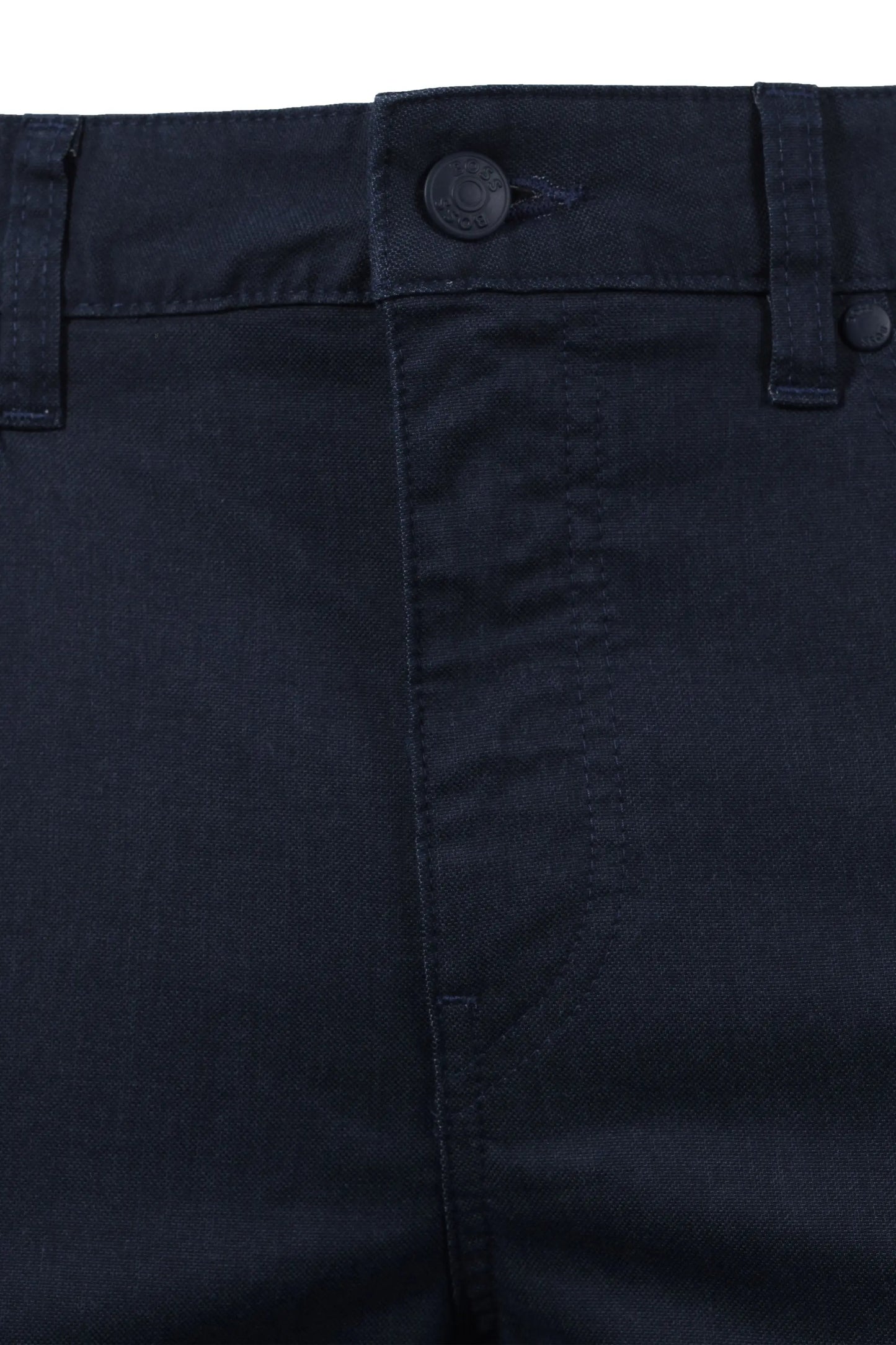 Close-up of dark blue BOSS  pants with a button on a white background
