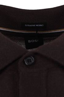 Close-up of a brown polo shirt with 'BOSS' branding and 'Extravine Merino' text.