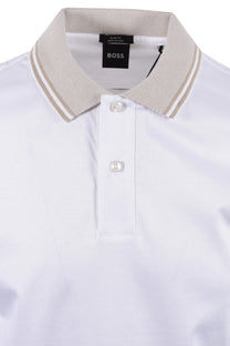 White polo shirt with beige collar and BOSS label on a white background