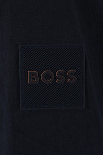 Dark blue jacket with 'BOSS' logo close up