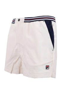 Full side angle picture of a pair of Fila hightide terry 4 pocket shorts in cream and navy with a tripe elasticated waistband and an embroidered Fila logo.