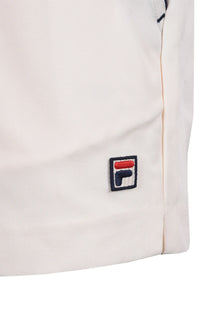 Close up of the embroidered Fila logo on a pair of Fila hightide terry pocket stripe shorts.