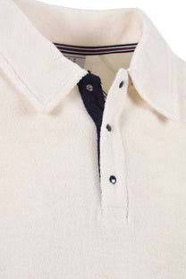Close up of the collar and 3 press stud placket of a Fila Massimo terry polo in gardenia colour.