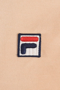 Close up of the Fila embroidered logo upon a neutral background