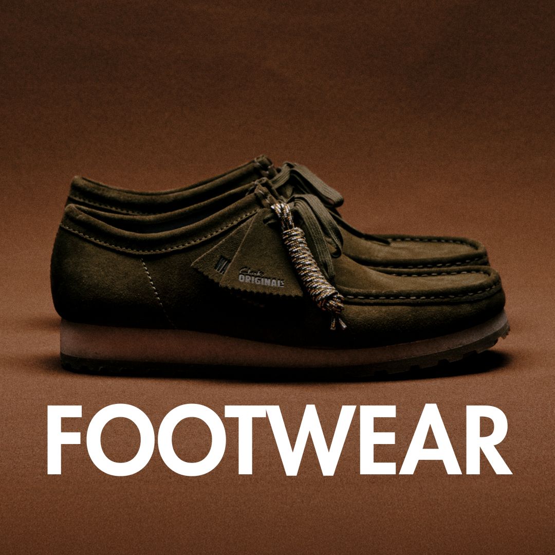 Footwear banner with a picture of a pair of Clarks Originals Wallabee shoes in a khaki or olive green on a brown backdrop in the background