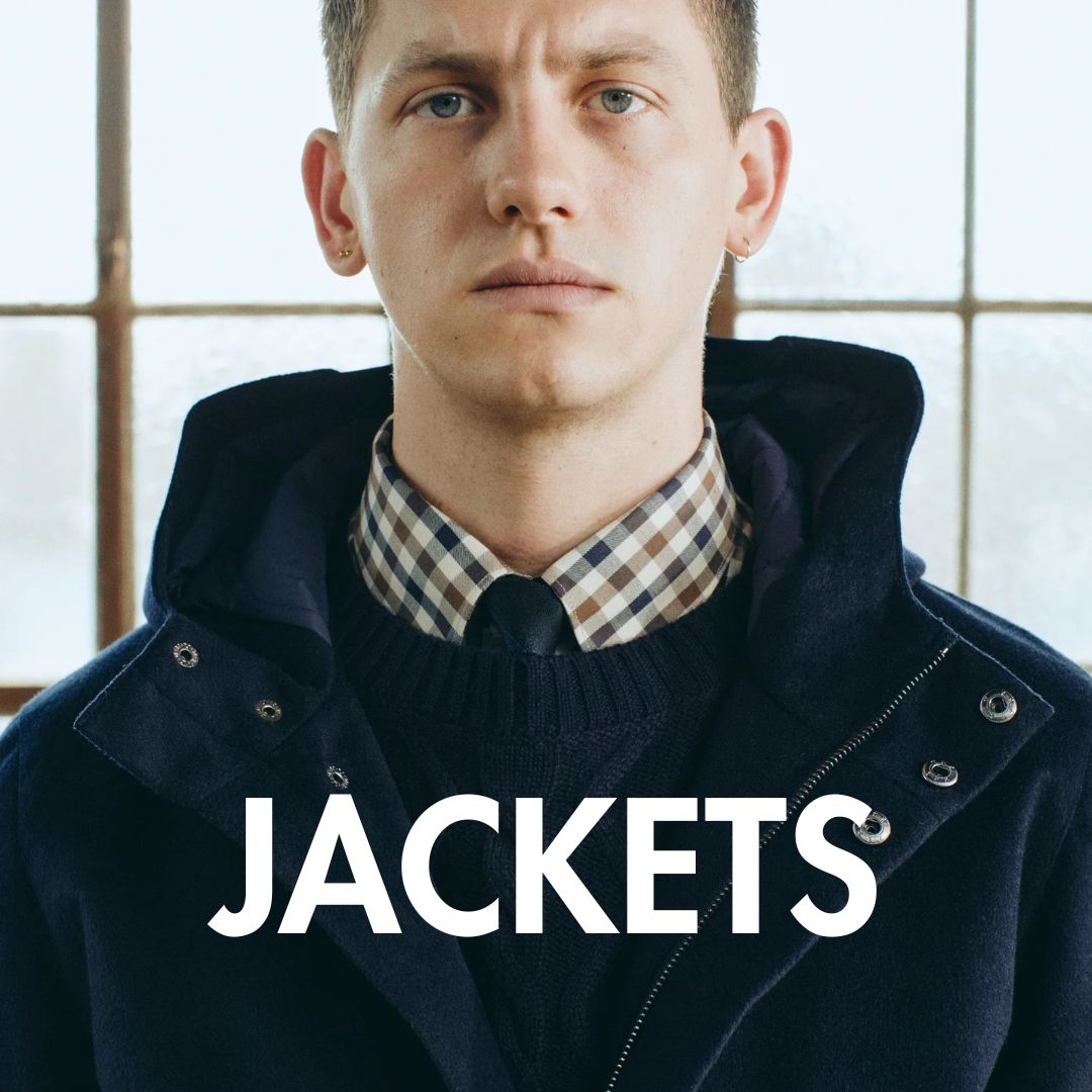 Jackets banner with a picture of a man wearing a wool jacket with a shirt and tie in the background.