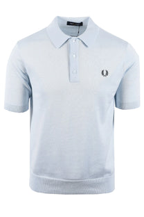 Light blue fred perry polo shirt with a logo on a white background