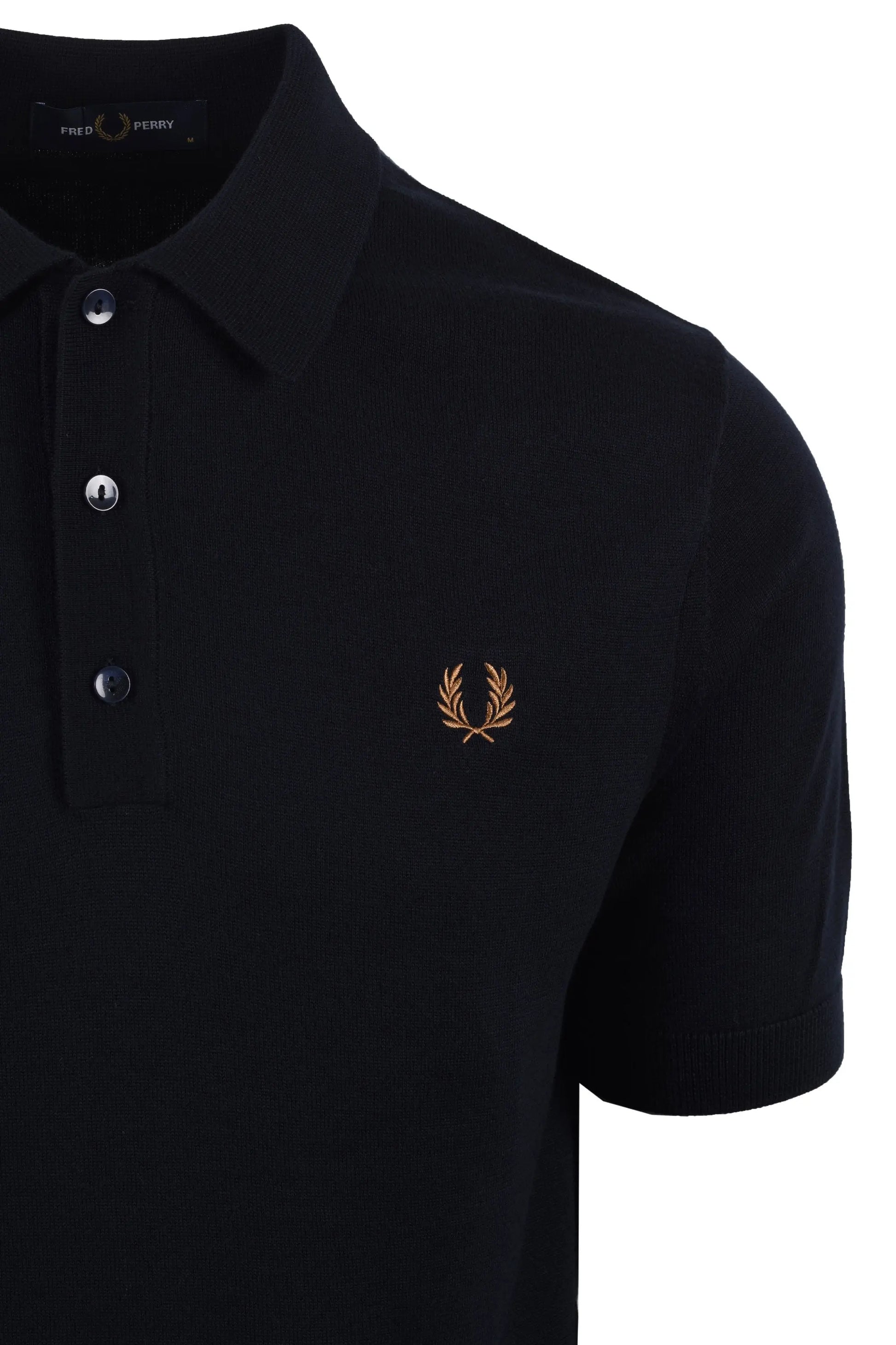 navy polo shirt with a fred perry logo on a white background