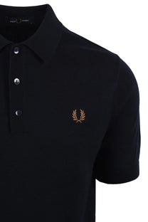 navy polo shirt with a fred perry logo on a white background