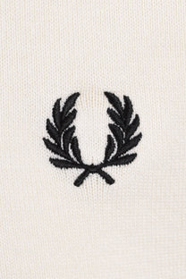 Black fred perry logo on a white polo close up