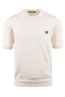 White knitted fred perry t-shirt with a small logo on a white background