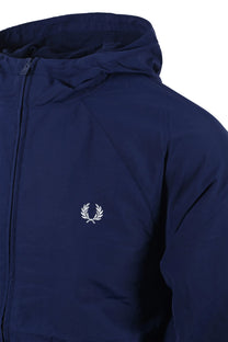 Side shot of a Fred Perry hooded shell jacket in the colour French navy. Shows the full length zipper as well as the iconic Fred Perry laurel Wreath logo.