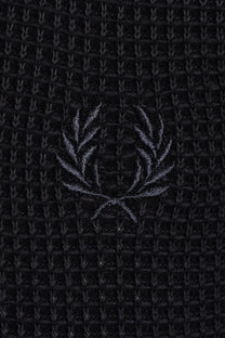 Black textured polo with a subtle fred perry logo