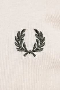 Embroidered green logo on a white t-shirt