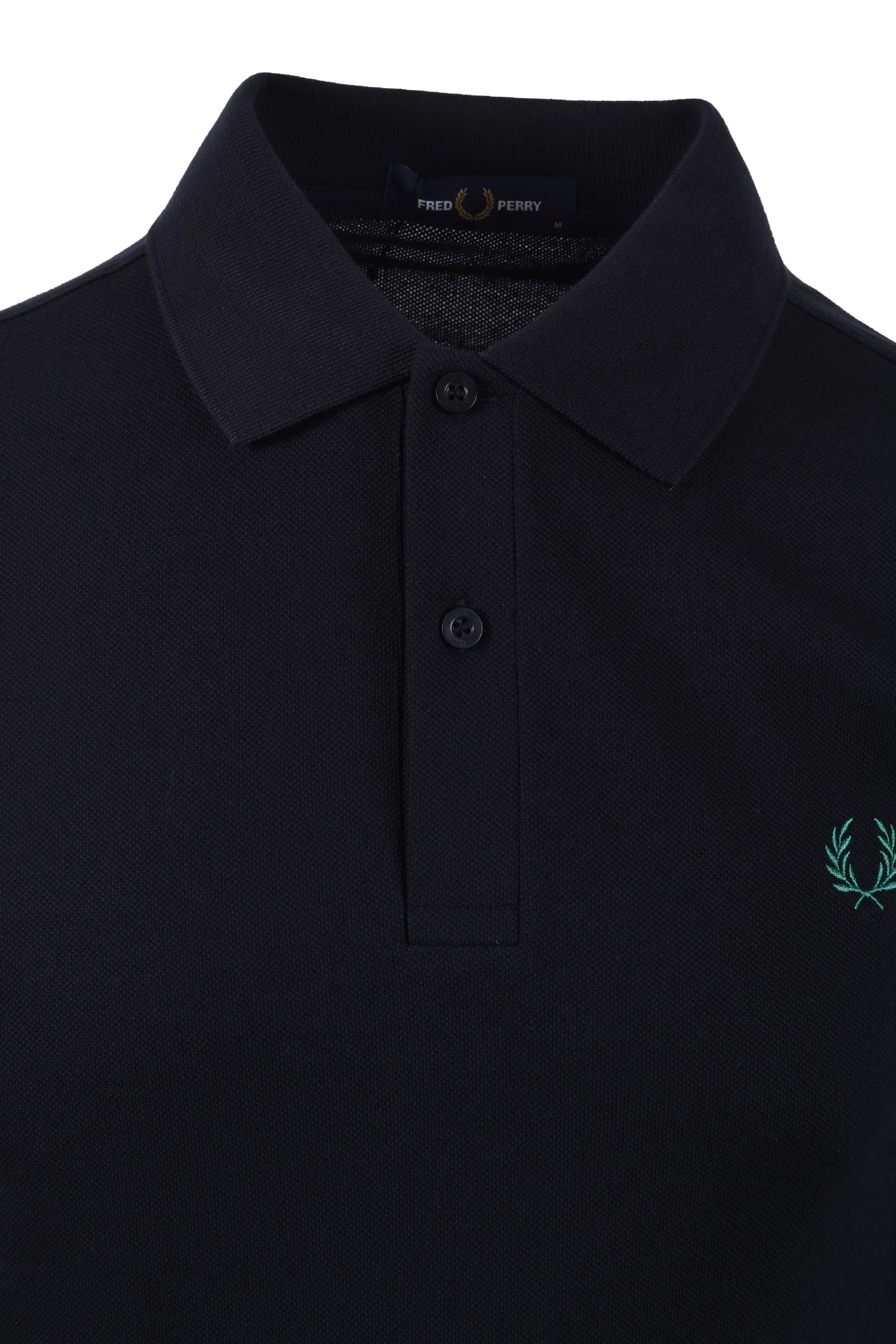 Close up of the collar and placket of a Navy coloured Fred Perry polo. Shows the label in the collar of the polo shirt.