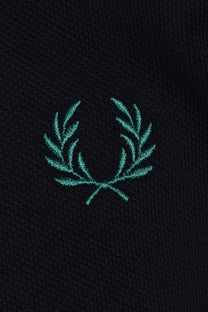 Teal embroidered fred perry logo on a navy polo
