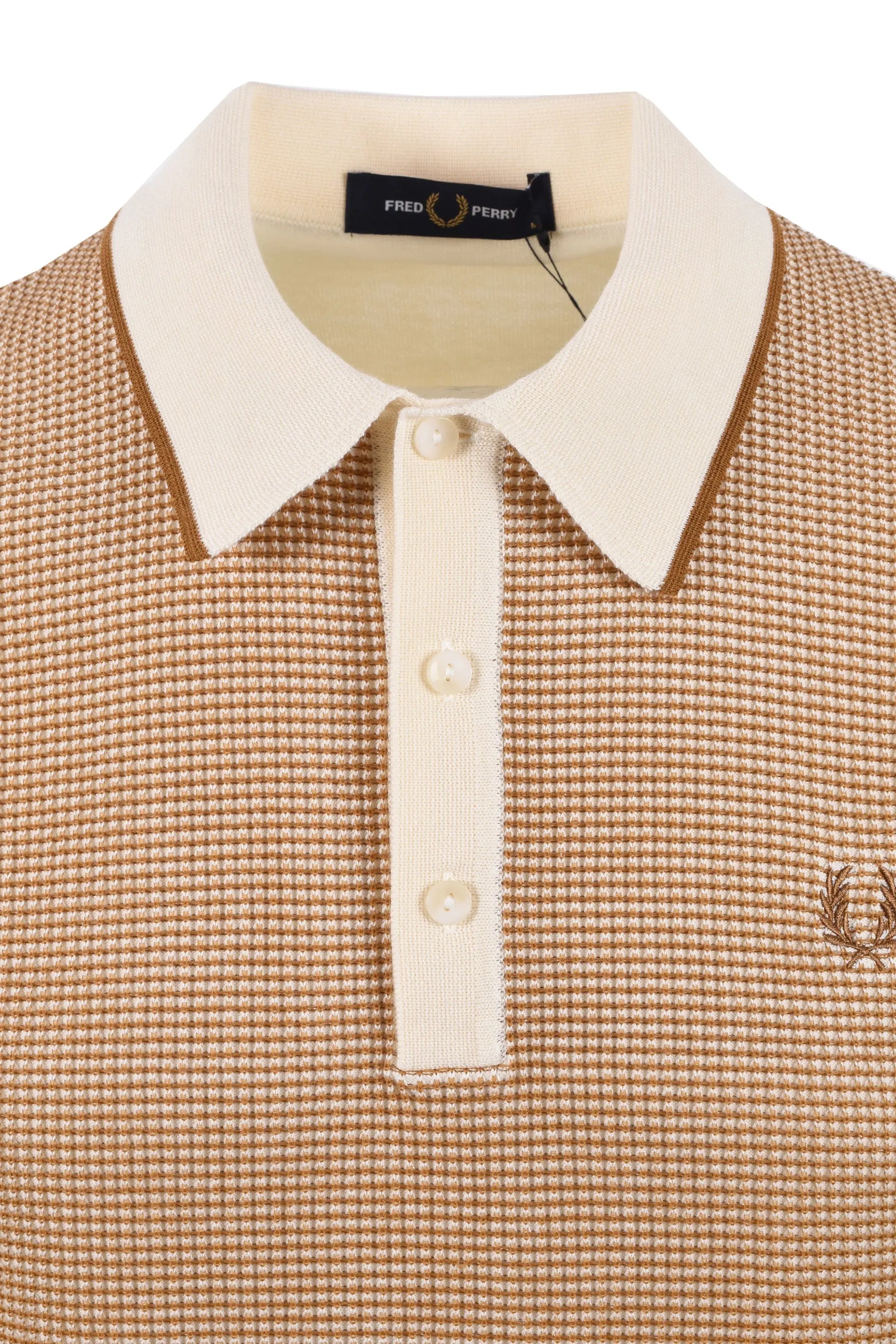 Close up of the 3 button contrasting colour placket and collar on a Fred Perry waffle knit polo shirt in the colour tonic.