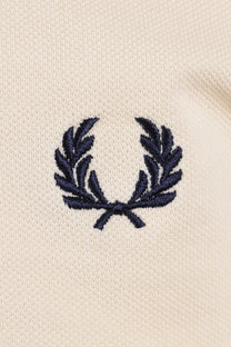navy fred perry logo on white polo close up 