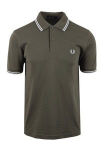 Green fred perry polo shirt with white trim on a white background