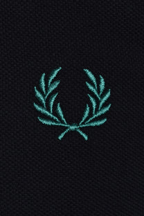 Teal fred perry embroidered logo on a navy polo