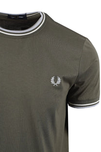 Green fred perry t-shirt with a white logo on a white background