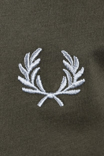 Close-up of a fred perry logo on a dark green background