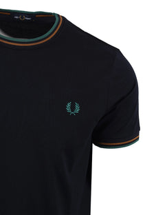 navy fred perry t-shirt with a green logo on a white background