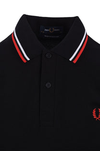close up of black fred perry polo collar with red and white tipping
