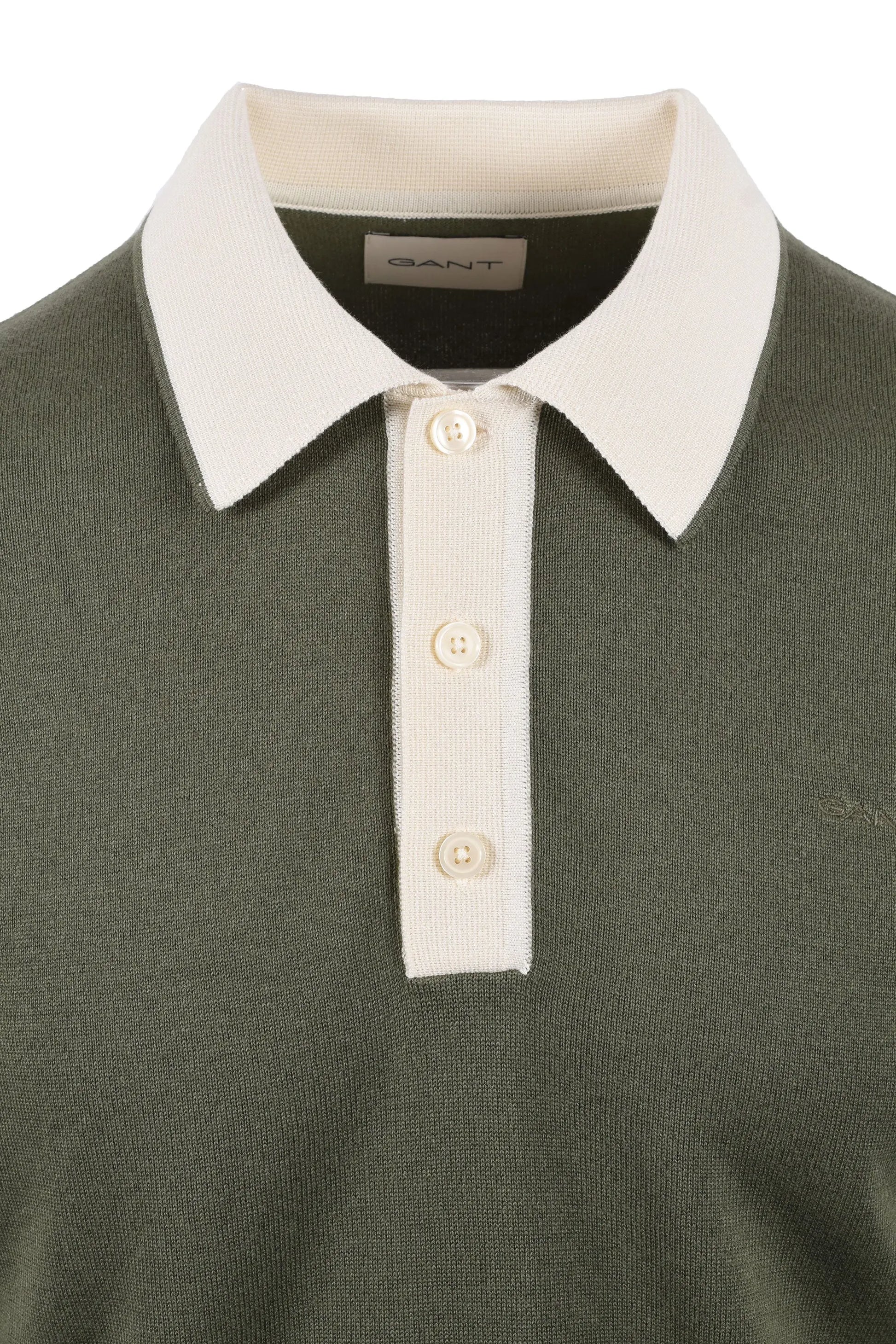 Close up of the contrasting colour 3 button placket on a Gant cotton modal knitted polo in the colour dry herb.