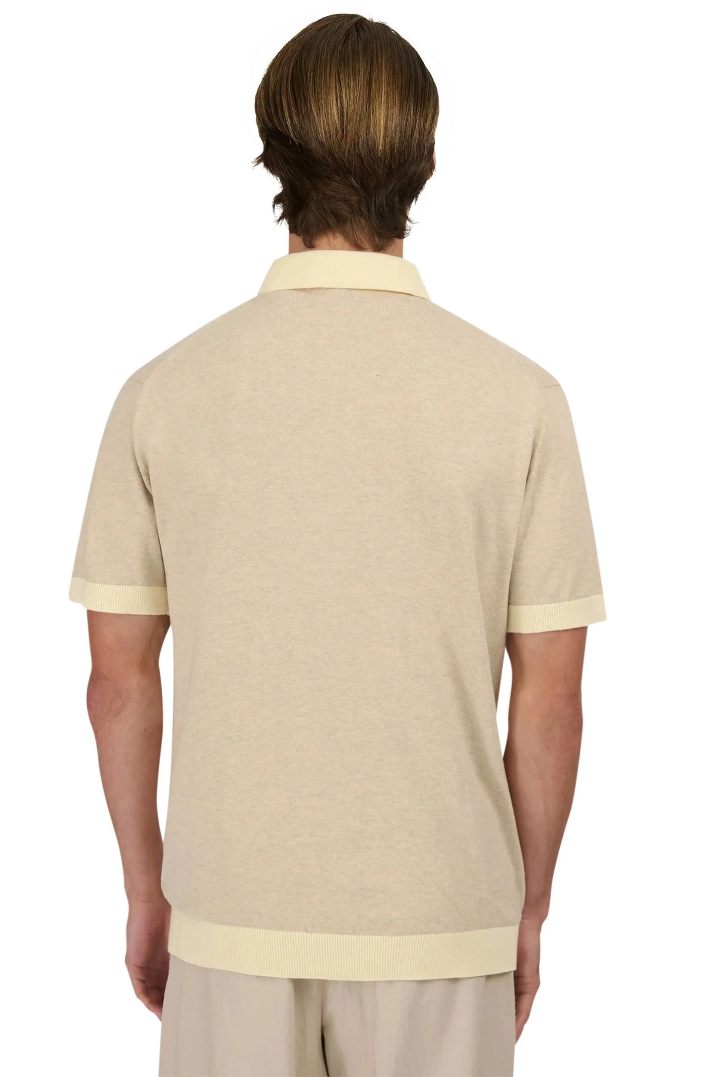 The behind of man wearing a sandbanks knitted polo in beige 