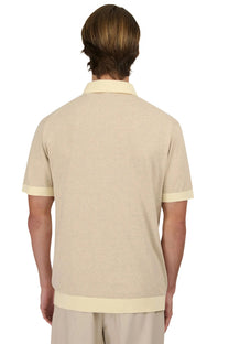 The behind of man wearing a sandbanks knitted polo in beige 