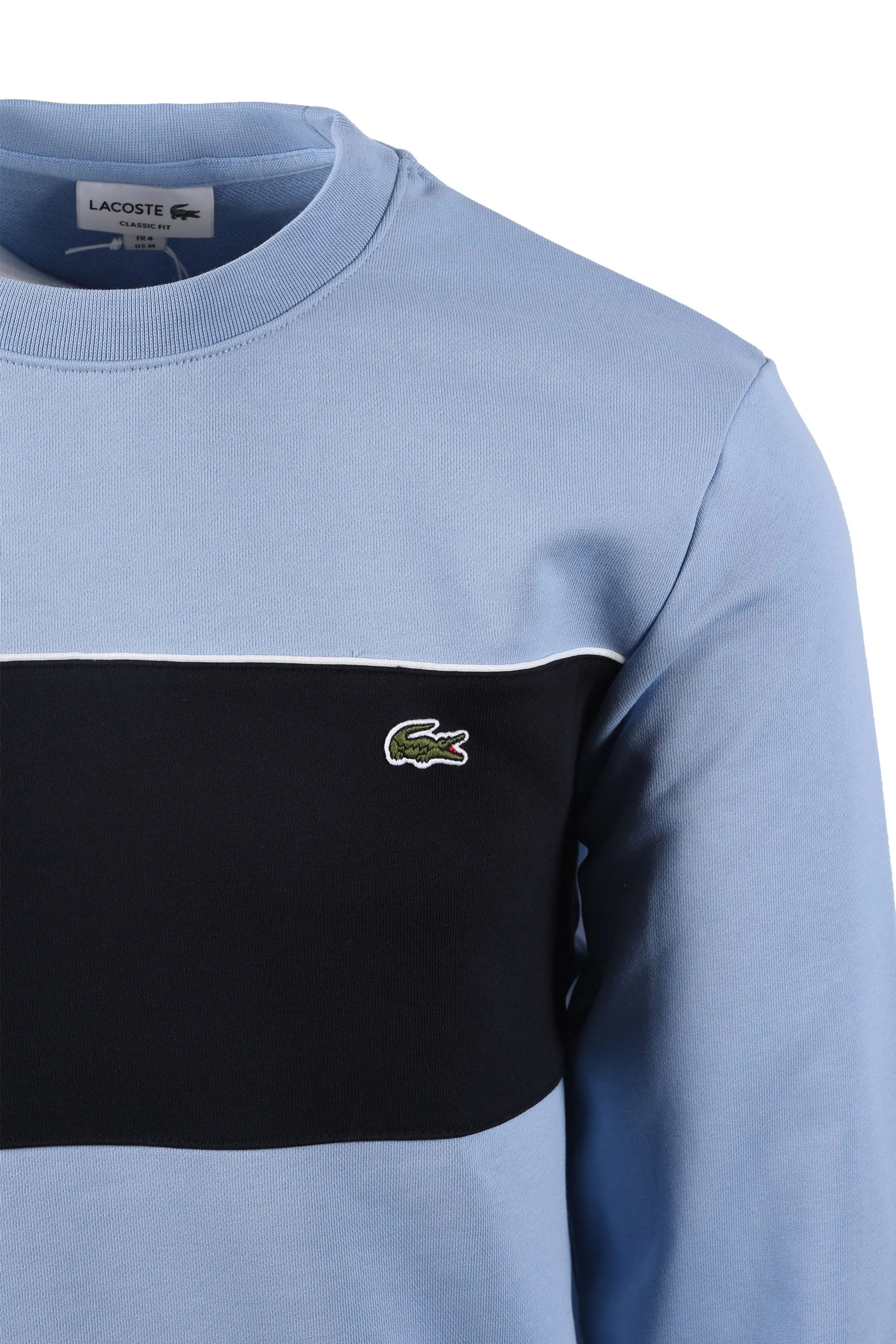 Side image of a Lacoste sweatshirt, featuring the iconic Lacoste crocodile logo.